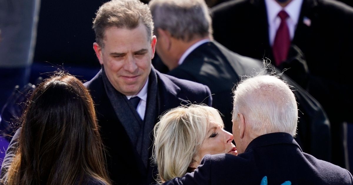 Hunter Biden looks on as his father, President Joe Biden, hugs his wife, first lady Jill Biden, on Inauguration Day in Washington.