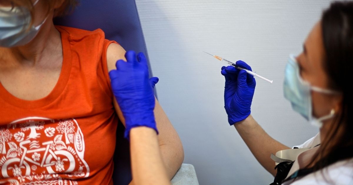 A health worker is injected with a dose of the AstraZeneca coronavirus vaccine at the Edouard Herriot Hospital in Lyon, France, on Saturday.