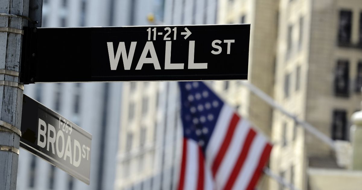 A sign for Wall Street is pictured in the stock image above.