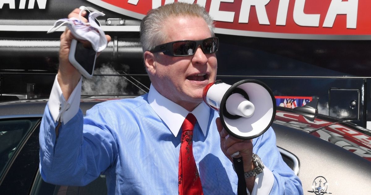 Conservative talk radio show Wayne Allyn Root speaks before hosting a protest caravan on the Las Vegas Strip to demand the reopening of the Nevada economy, hit hard by coronavirus-related closures, on April 24, 2020, in Las Vegas.