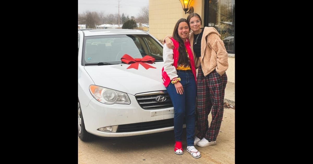 Haley Bridges, who won a car at the company Christmas dinner, and Hokule’a Taniguchi, the friend and coworker Bridges gifted the car to