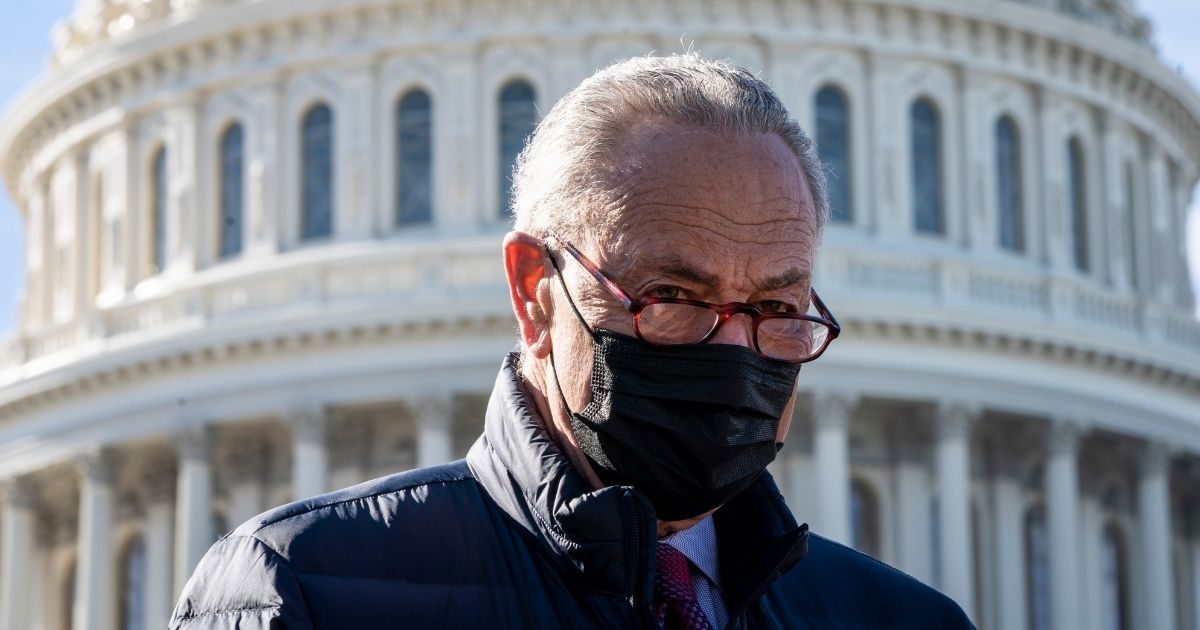 Senate Majority Leader Chuck Schumer speaks during a news conference outside the US Capitol on Feb. 4, 2021, in Washington, D.C.