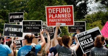 Pro-life activists hold a rally opposing federal funding for Planned Parenthood in front of the US Capitol on July 28, 2015, in Washington, D.C.
