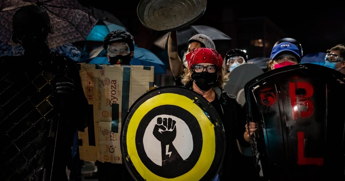 Protesters march on Sept. 7, 2020, following the release of video showing the death of Daniel Prude while in police custody in Rochester, New York. (