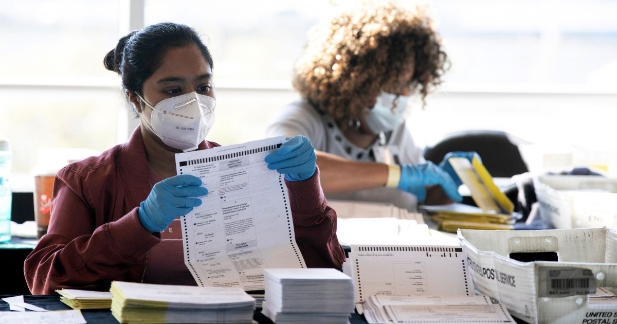 Election workers count Fulton County ballots at State Farm Arena on Nov. 4, 2020, in Atlanta, Georgia.