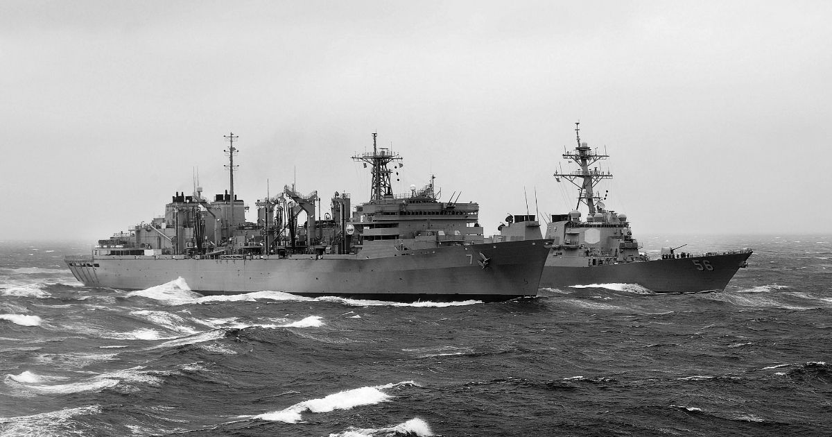 Military Sealift Command fast combat support ship USNS Rainier (T-AOE-7) and Arleigh Burke-class guided-missile destroyer USS John S. McCain (DDG 56) during a replenishment-at-sea.
