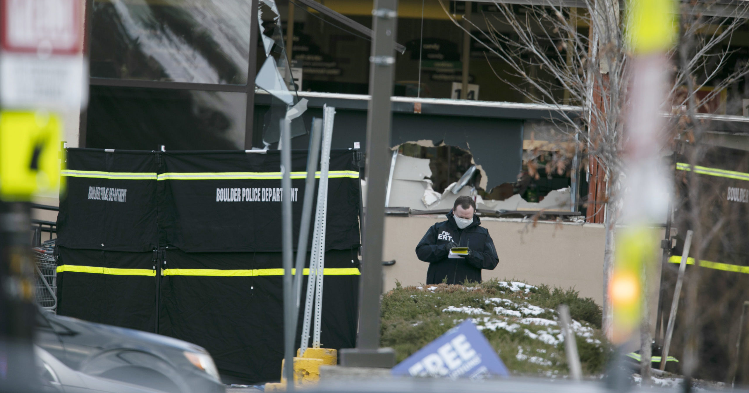 Police work on the scene outside of a King Soopers grocery store in Boulder, Colorado, where authorities say 10 people were killed in a shooting Monday.