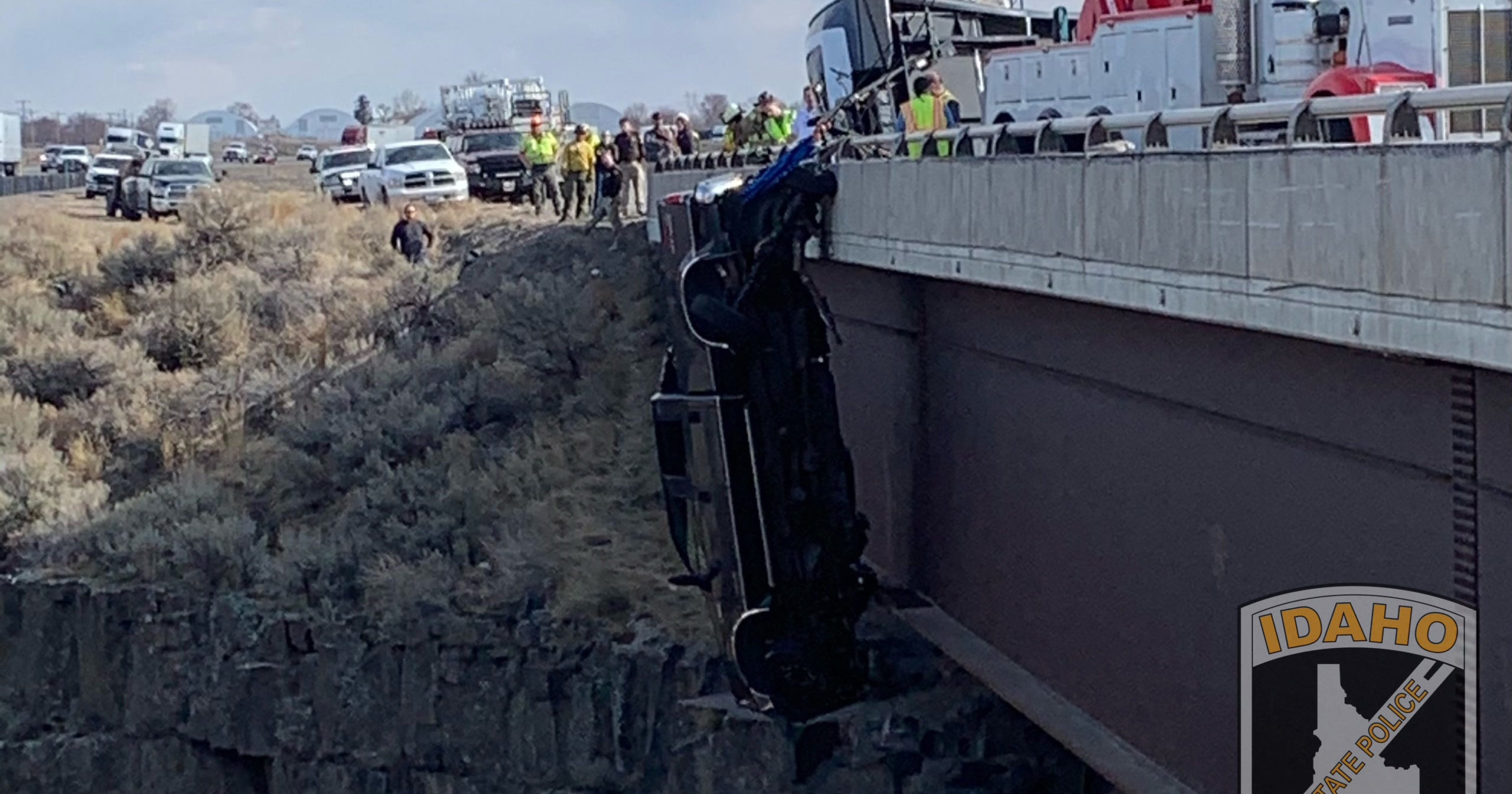 A pickup truck dangles above a deep gorge after plunging off a bridge in southern Idaho on March 15, 2021.