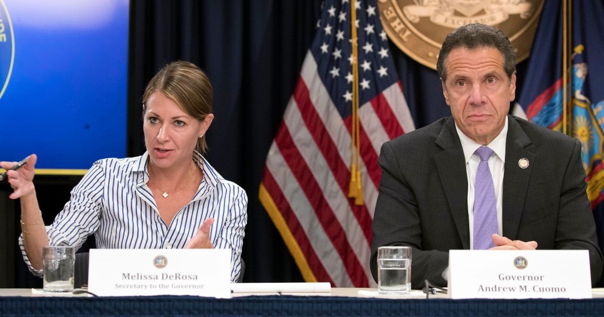Secretary to the governor Melissa DeRosa, left, is joined by Democratic New York Gov. Andrew Cuomo, right, as she speaks to reporters during a news conference in New York on Sept. 14, 2018.