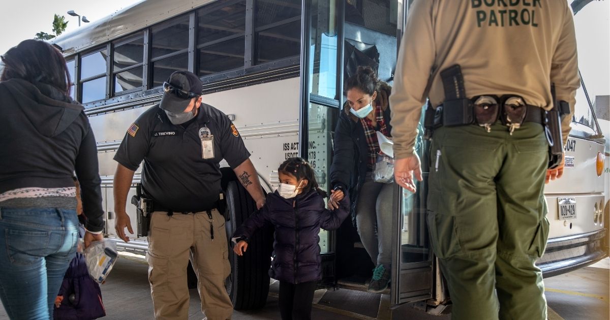 U.S. immigration officers release asylum seekers at a bus station on Feb. 25, 2021, in Brownsville, Texas.