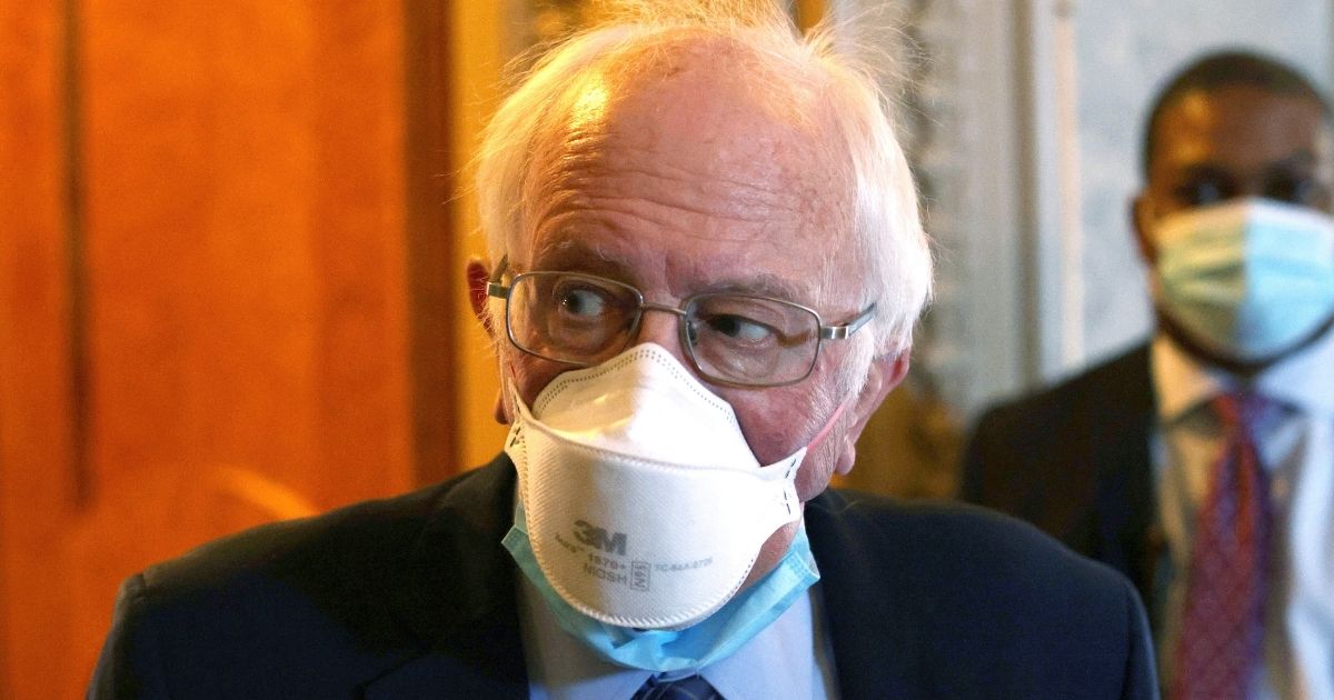 Progressive Vermont Sen. Bernie Sanders passes through a hallway at the U.S. Capitol on March 5 in Washington, D.C.