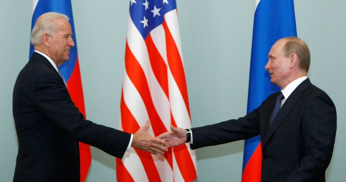 Biden and Putin shake hands