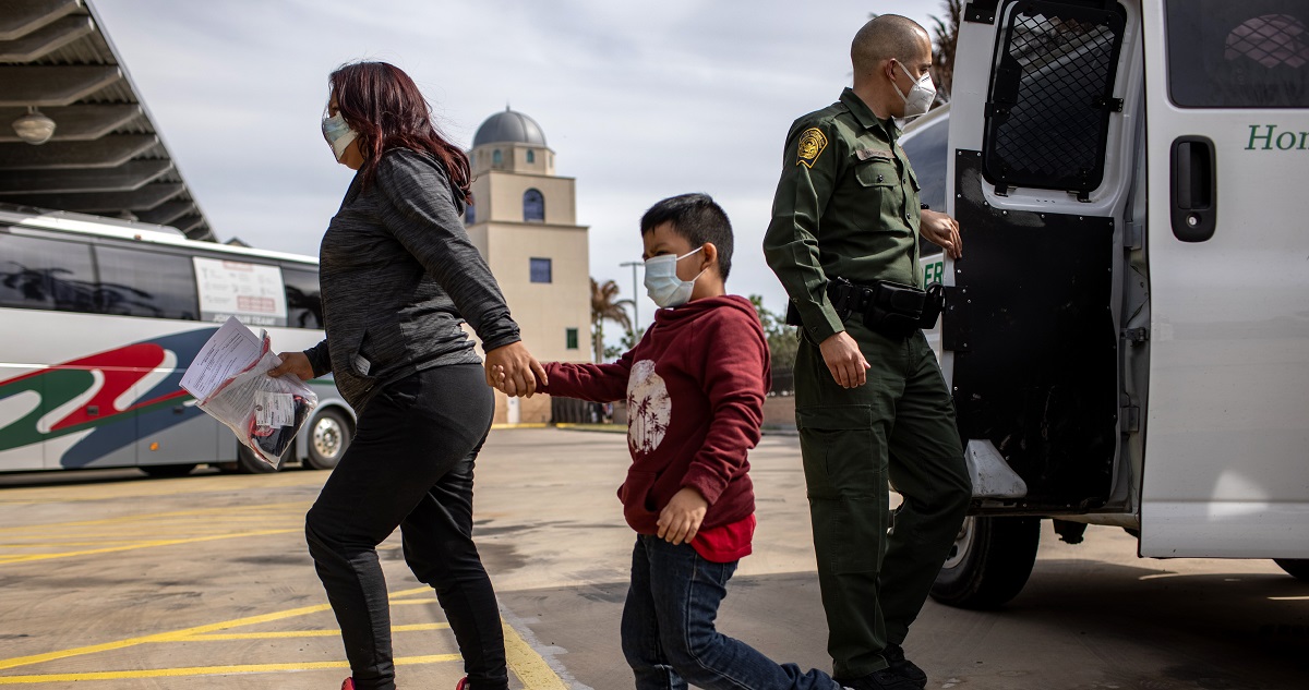 Border Patrol agents release migrants at a bus station in Brownsville, Texas, on Feb. 26.