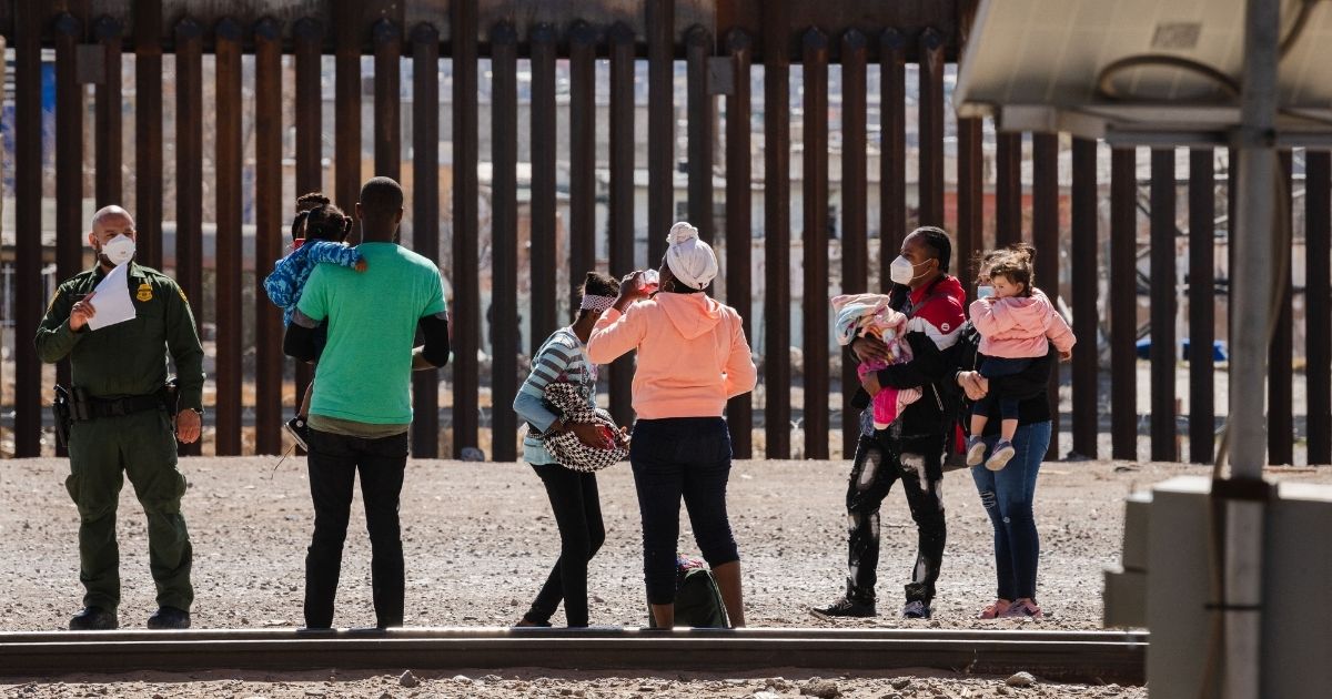 Border Patrol agents apprehend a group of migrants near downtown El Paso, Texas, following the congressional border delegation visit on Monday.