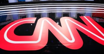 The CNN logo is seen on the stage on Jan. 14, 2020, before a Democratic presidential primary debate hosted by CNN and the Des Moines Register in Des Moines, Iowa.
