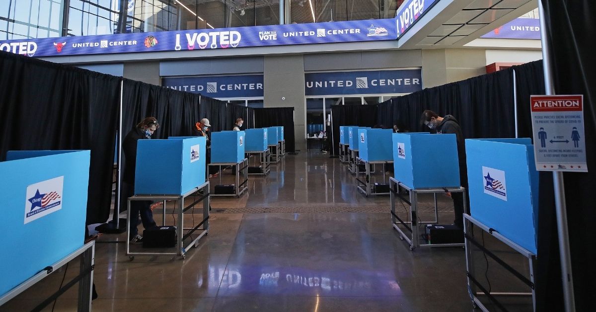 Voters cast their ballots in the east atrium of the United Center in Chicago, where a polling place with 70 machines was set up for the Nov. 3 election.