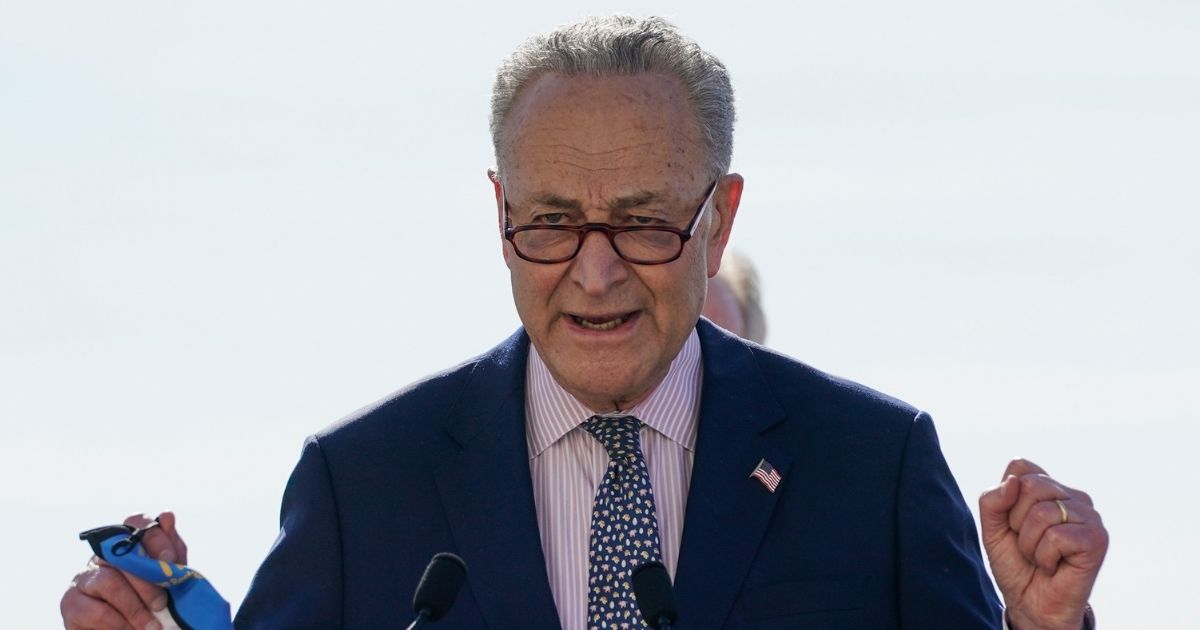 Senate Majority Leader Chuck Schumer speaks before signing the $1.9 trillion COVID-19 relief bill during a bill enrollment ceremony on the West Front of the U.S. Capitol in Washington, D.C., on Wednesday.