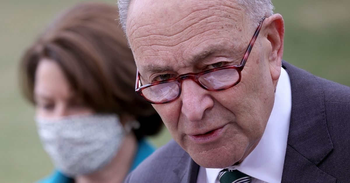 Senate Majority Leader Chuck Schumer announces the introduction of the For the People Act outside the U.S. Capitol on Wednesday in Washington, D.C.