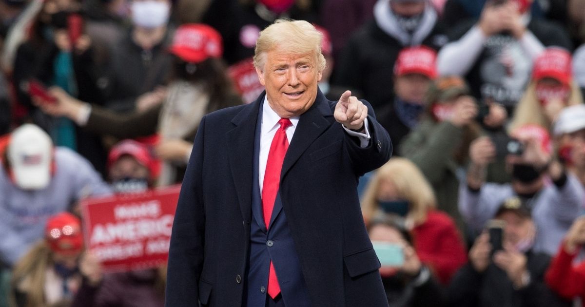 President Donald Trump gestures at supporters during a campaign rally on Oct. 25, 2020, in Londonderry, New Hampshire.