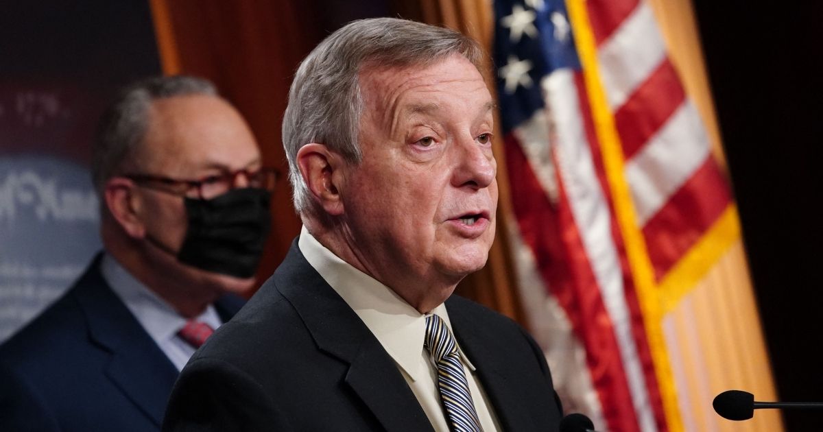 Senate Majority Whip Dick Durbin speaks while Senate Majority Leader Chuck Schumer looks on during a news conference at the Capitol in Washington on Tuesday.
