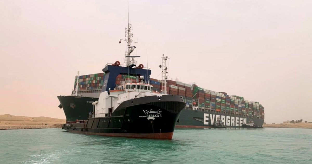 A handout picture released by the Suez Canal Authority on March 24 shows a part of the Taiwan-owned MV Ever Given that is lodged sideways and impeding all traffic across the waterway of Egypt's Suez Canal.
