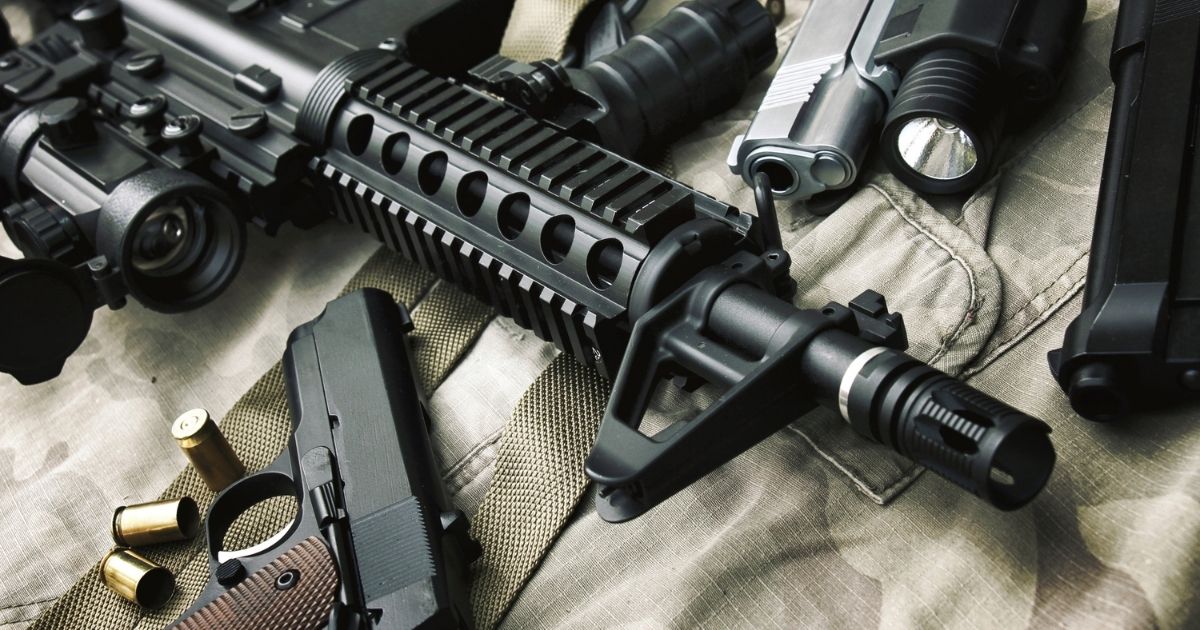 A collection of firearms and ammunition is pictured in the stock image above.