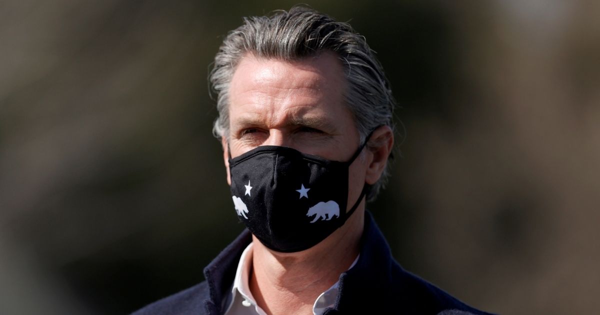 Democratic Gov. Gavin Newsom of California looks on during a news conference after touring Barron Park Elementary School on March 2, 2021, in Palo Alto, California.