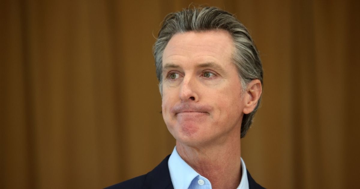 Democratic California Gov. Gavin Newsom looks on during a news conference after he toured the newly reopened Ruby Bridges Elementary School on March 16, in Alameda, California. Newsom is traveling throughout California to highlight the state's efforts to reopen schools and businesses as he faces the threat of recall.