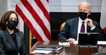 President Joe Biden listens to Vice President Kamala Harris during a virtual bilateral meeting with Prime Minister Justin Trudeau of Canada in the Roosevelt Room of the White House on Feb. 23.