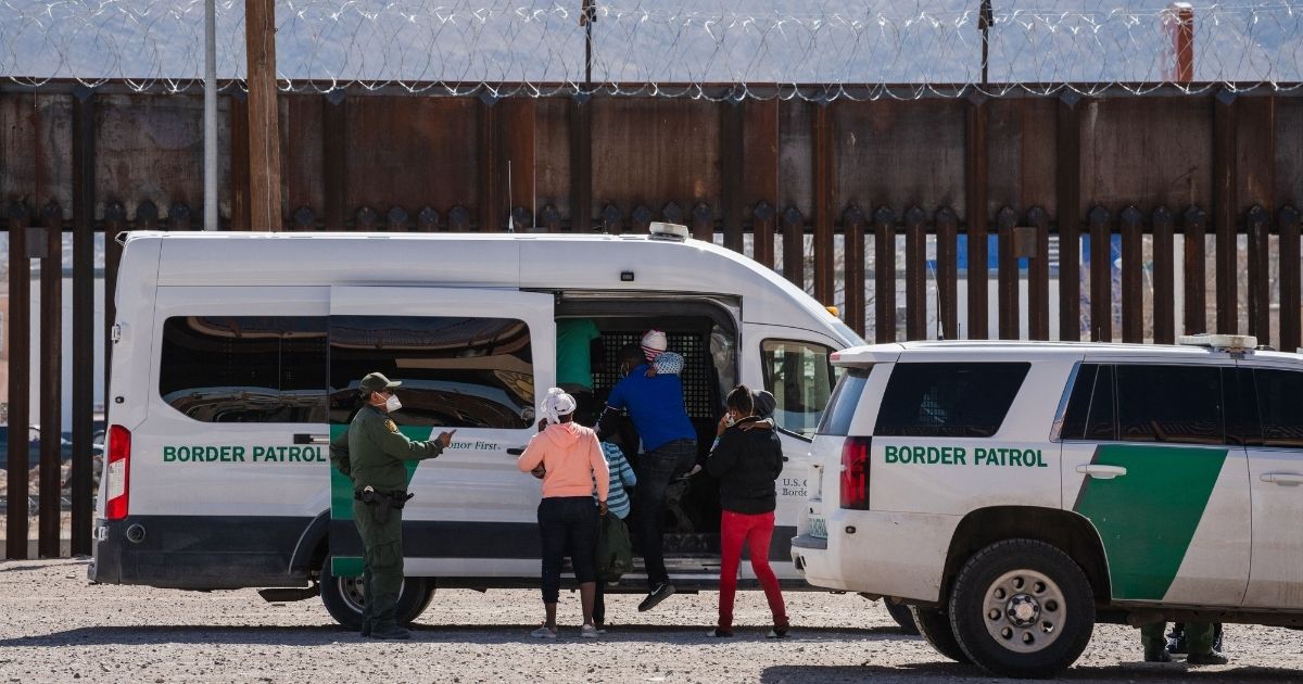 Border Patrol agents apprehend a group of migrants near downtown El Paso, Texas, following the congressional border delegation visit on Monday.