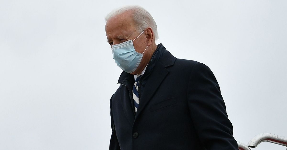 President Joe Biden steps off Air Force One upon arrival at Andrews Air Force Base in Maryland on Monday.