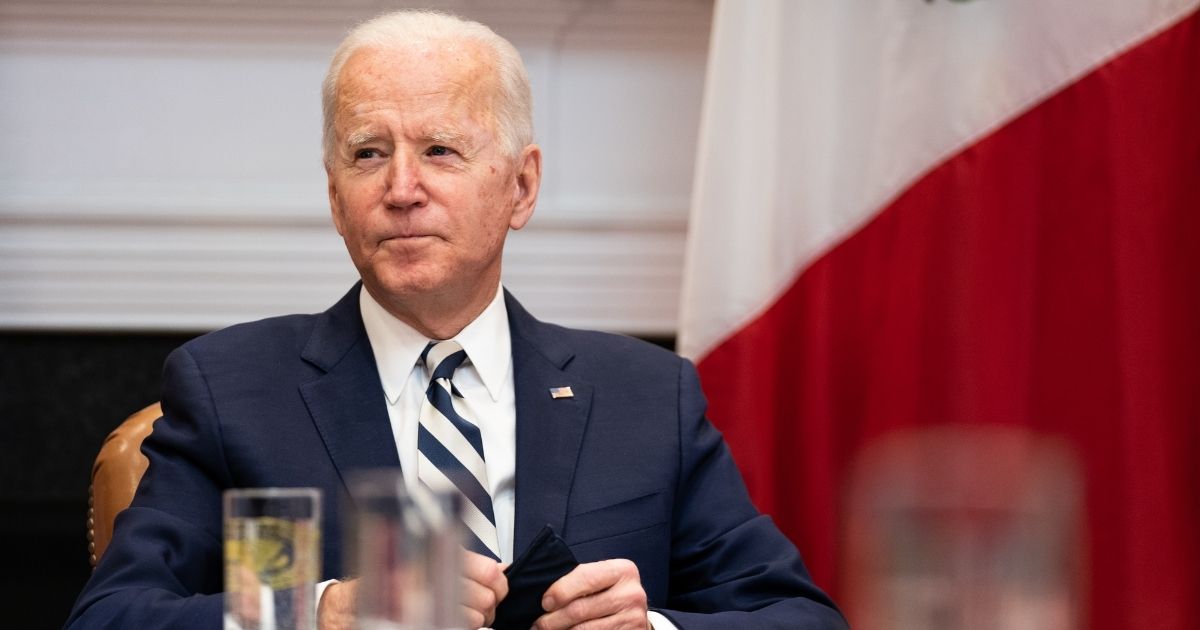 U.S. President Joe Biden looks on during a virtual meeting with Mexican President Andrés Manuel López Obrador in the Roosevelt Room of the White House on Monday in Washington, D.C.