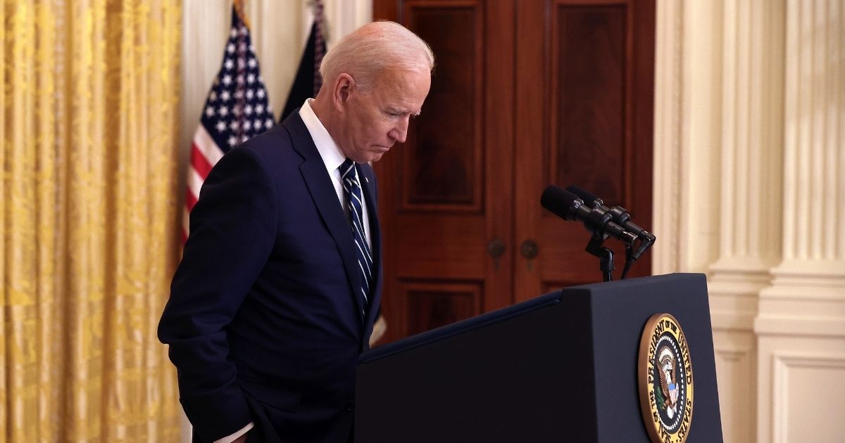 President Joe Biden talks to reporters during the first news conference of his presidency in the East Room of the White House on Thursday in Washington, D.C.