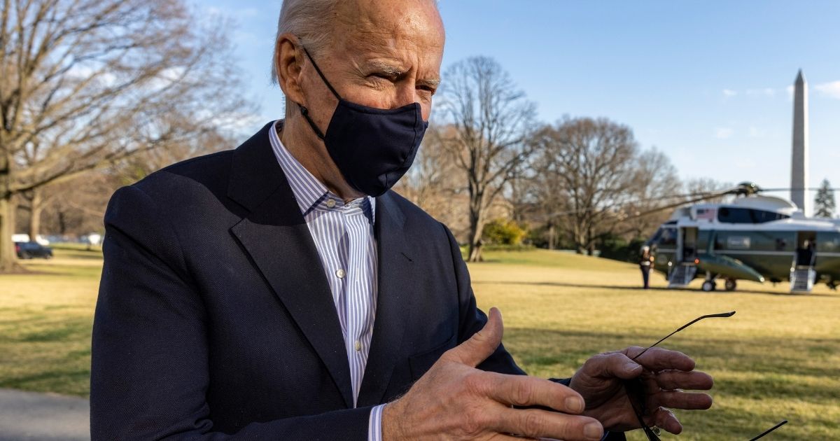 President Joe Biden stops to talk to reporters on the South Lawn of the White House on Sunday in Washington, D.C.