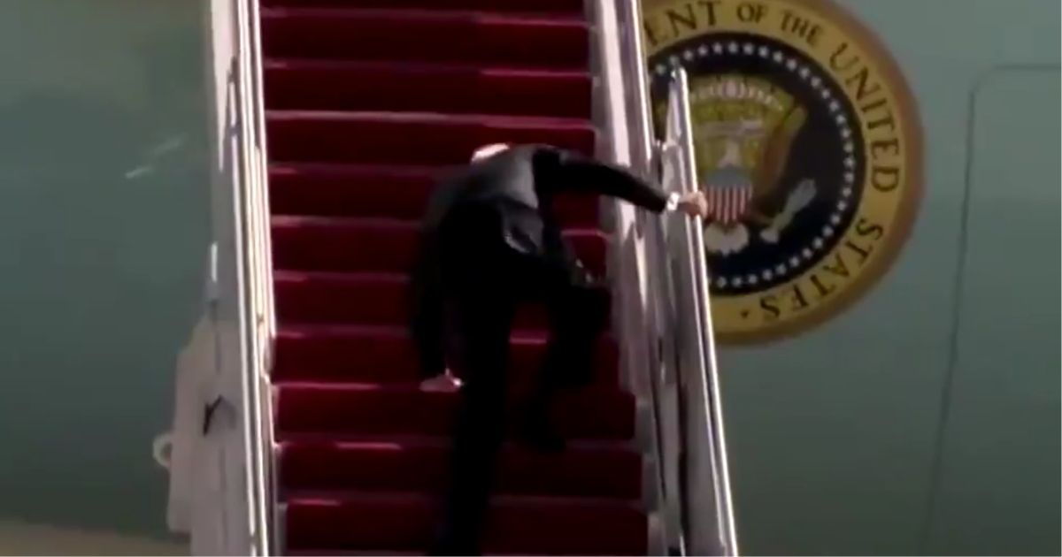 President Joe Biden stumbles on the stairs to Air Force One on Friday at Joint Base Andrews in Maryland.