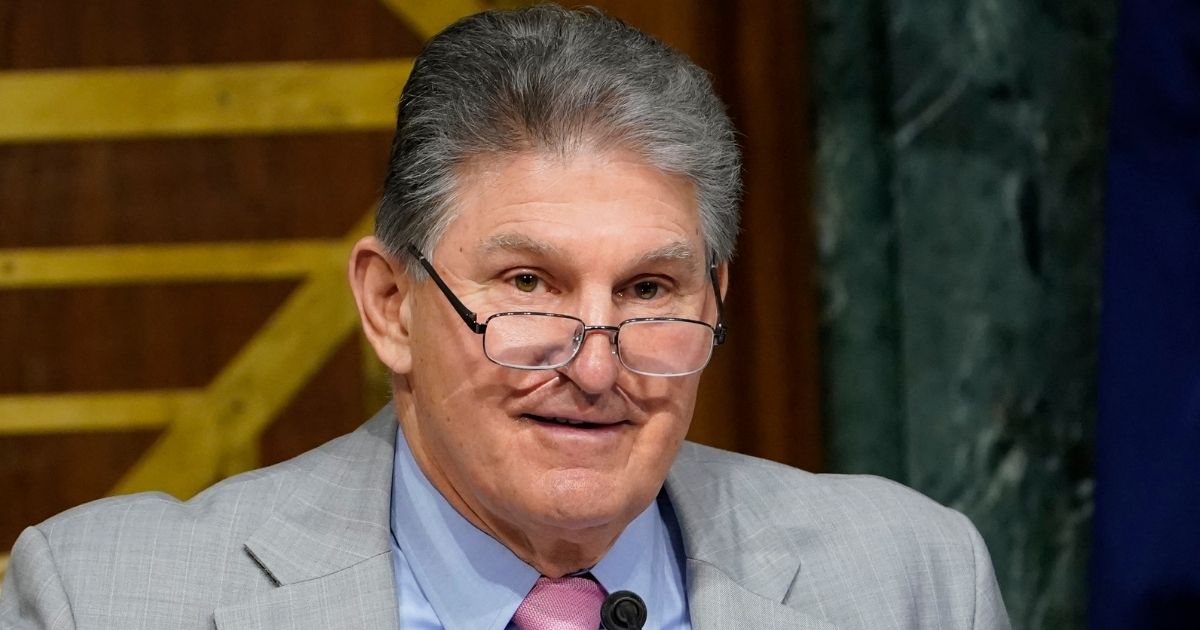 Democratic Sen. Joe Manchin of West Virginia looks on before a hearing on Capitol Hill in Washington on March 11.