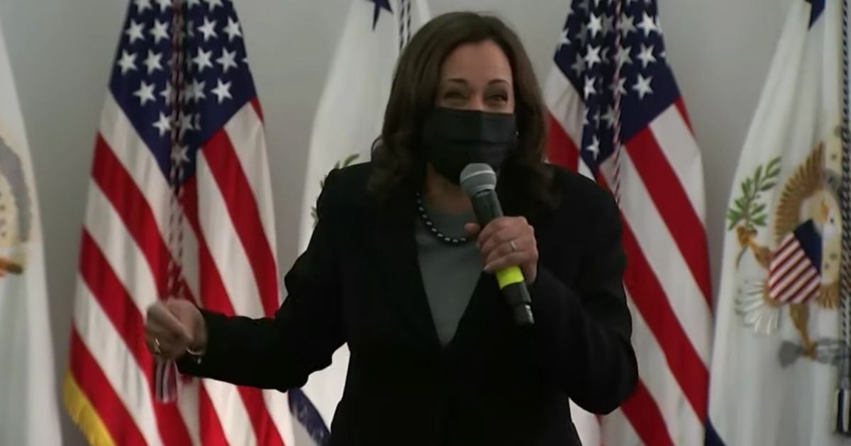 Vice President Kamala Harris laughs while discussing struggling families at an event in West Haven, Connecticut.