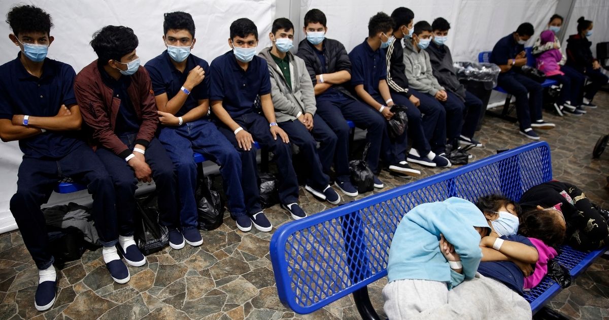 Young unaccompanied migrants wait for their turn at the secondary processing station inside the Donna Department of Homeland Security holding facility, the main detention center for unaccompanied children in the Rio Grande Valley in Donna, Texas, on Tuesday.
