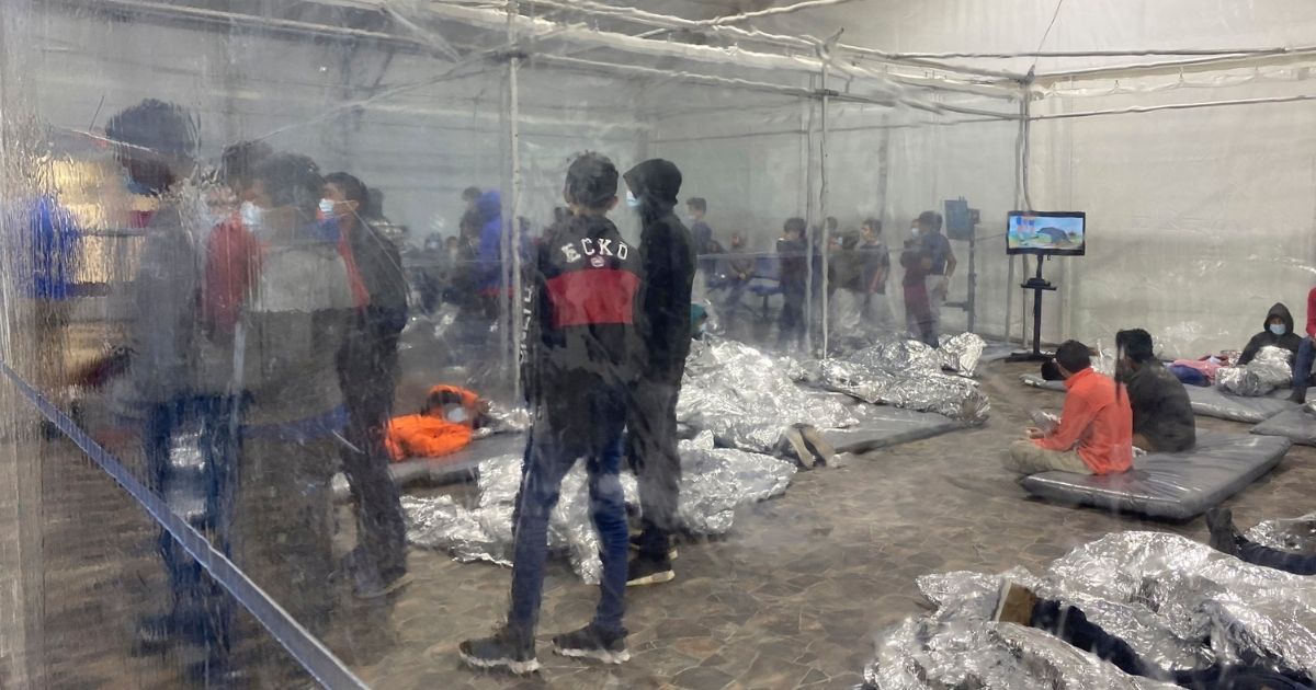 Migrants detained at a Customs and Border Protection overflow facility in Donna, Texas, are seen Saturday.