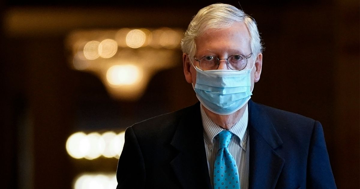 Republican Senate Minority Leader Mitch McConnell leaves his office and walks to the Senate floor at the U.S. Capitol on Feb. 8, 2021, in Washington, D.C.