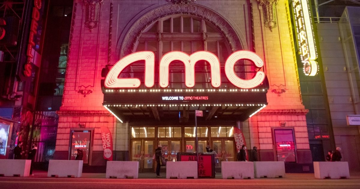 A view of the AMC Empire 25 where "now open" banners are displayed outside in Times Square on March 5 in New York City.