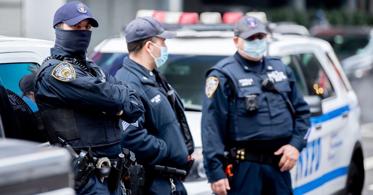 NYPD officers wear masks in Times Square on Thursday in New York City. (Roy Rochlin / Getty Images)