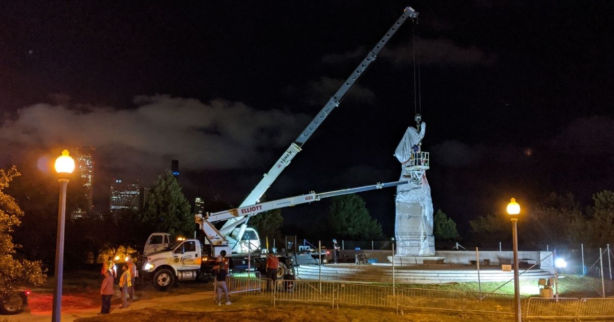 A statue of Christopher Columbus at Grant Park in Chicago is removed early July 24.