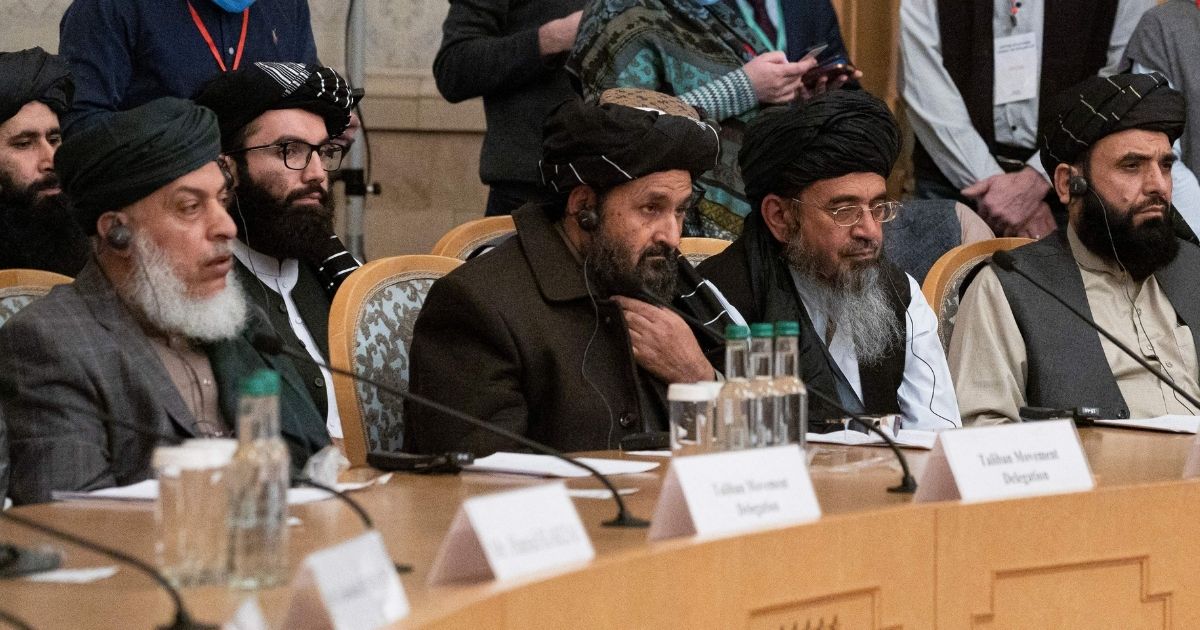 Taliban co-founder Mullah Abdul Ghani Baradar, center, and other members of the Taliban delegation attend an international conference in Moscow on a peaceful solution to the conflict in Afghanistan on March 18.