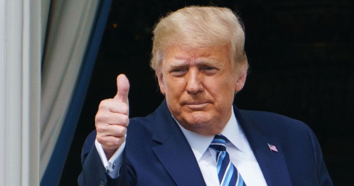 Then-President Donald Trump gives a thumbs up after speaking from the South Portico of the White House in Washington on Oct. 10.