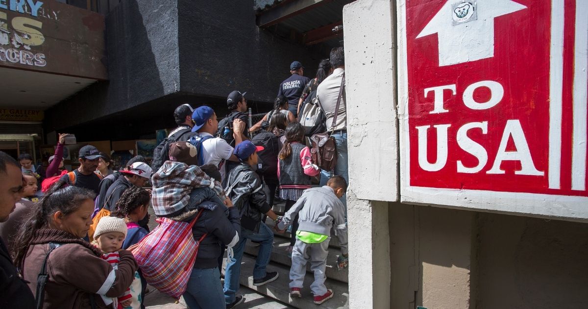 Mexican migrants arrive at a U.S. port of entry.