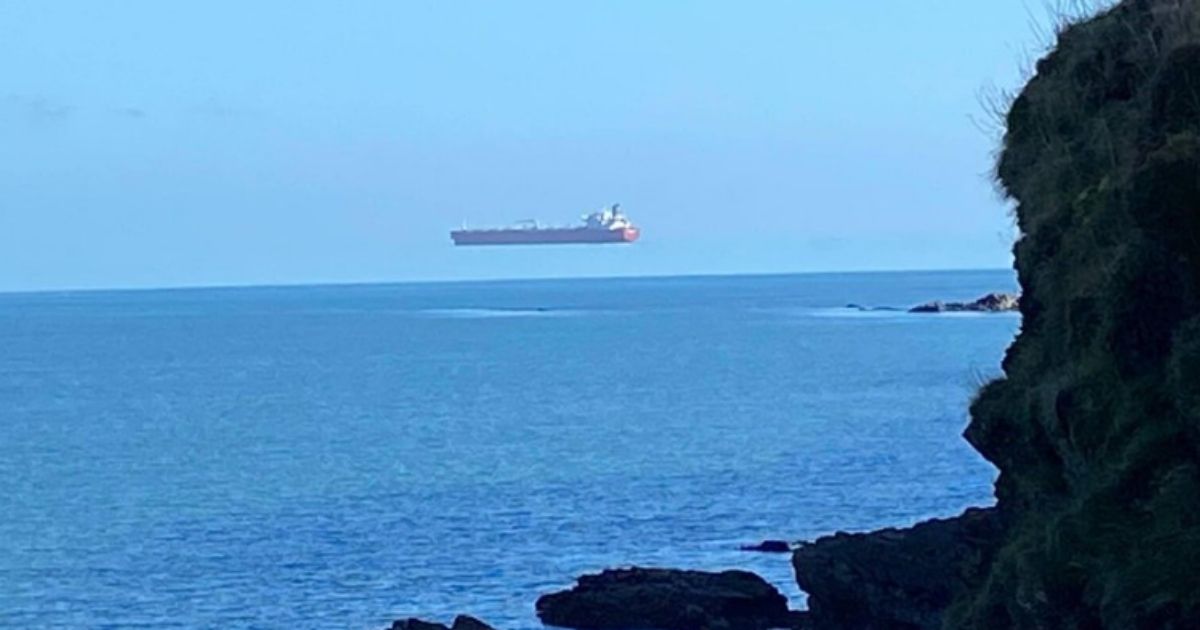 This picture taken in southwest England by area resident David Morris on his morning walk in March 2021 shows an optical illusion of a ship hovering above the sea.