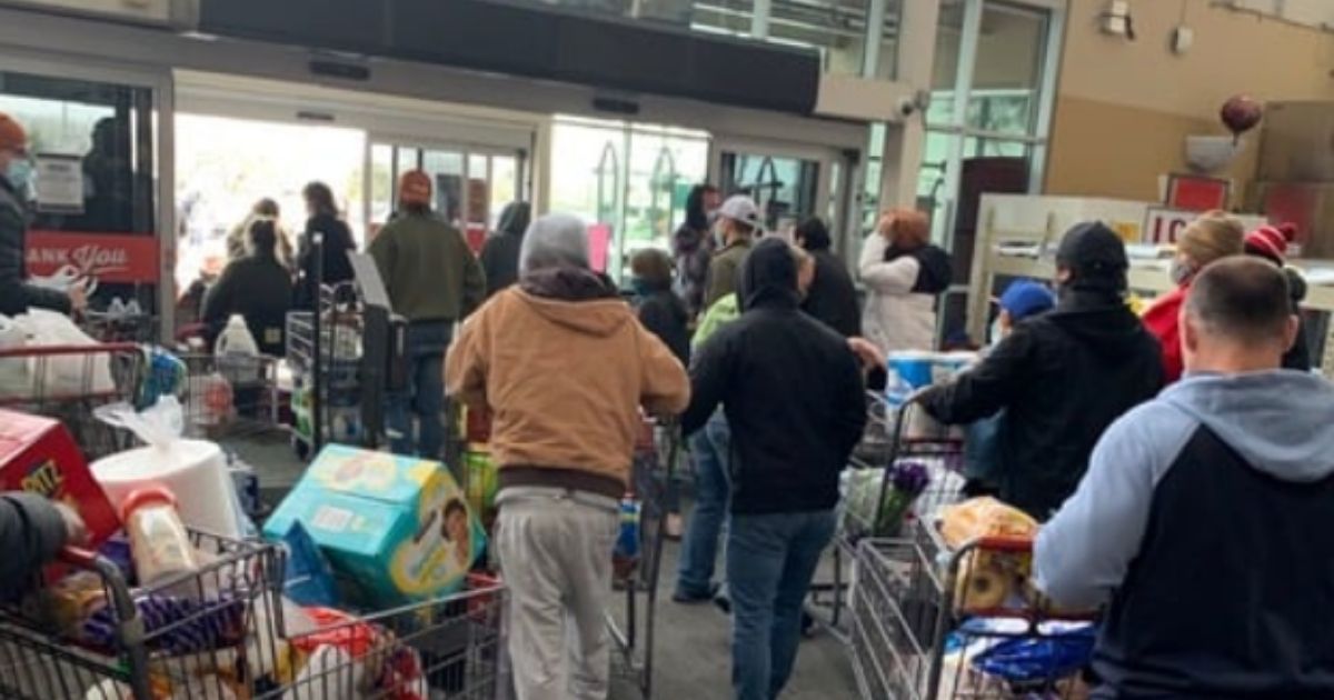 Shoppers at the H.E.B. supermarket in Leander, Texas, head for the doors with their items on Feb. 16, 2021, after being told by store employees that the items were free.