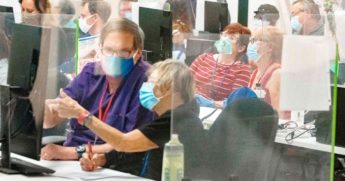 Poll workers count ballots inside the Maricopa County Election Department in Phoenix, Arizona, on Nov. 5.