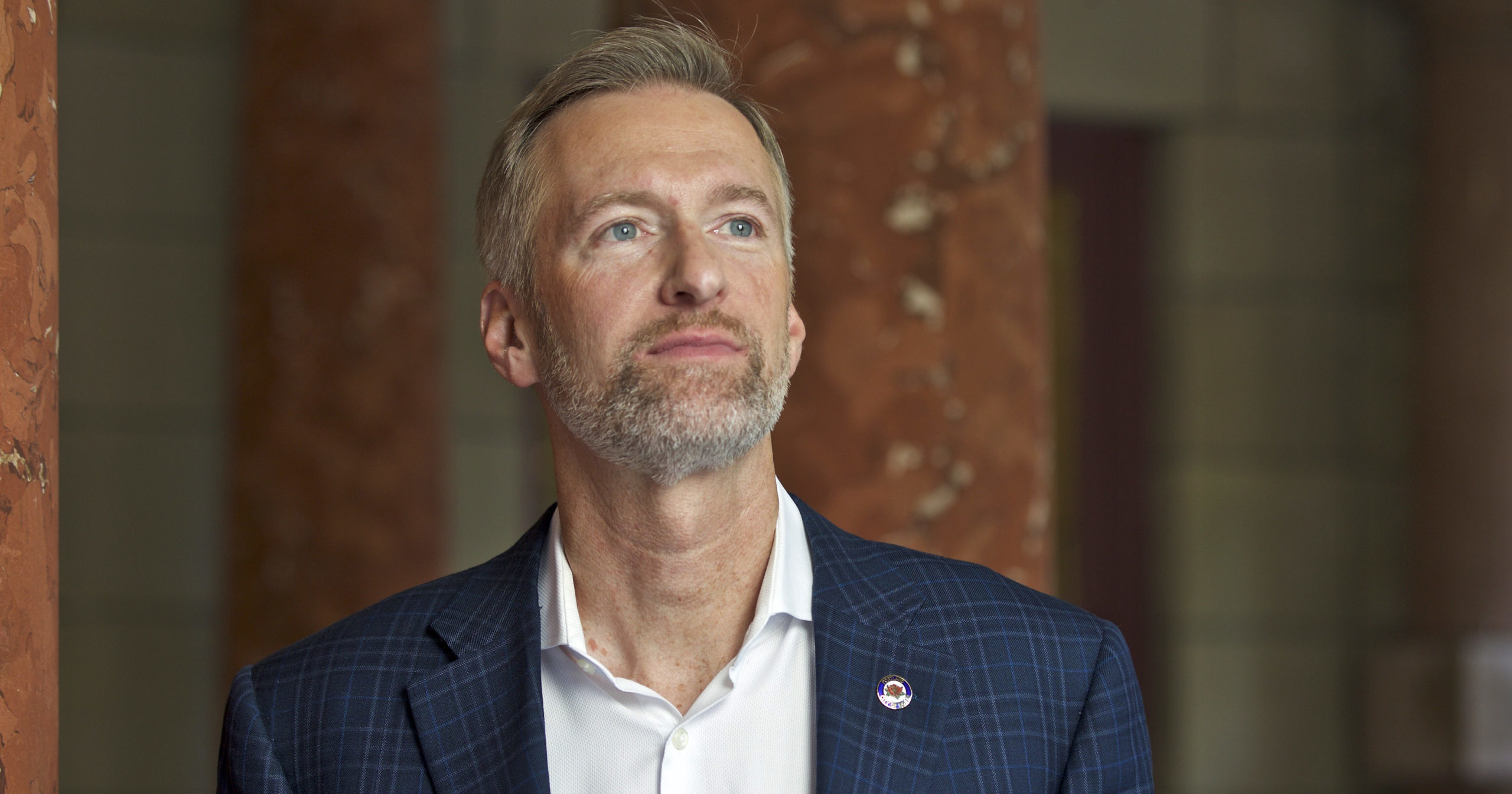 Portland Mayor Ted Wheeler poses for a photo outside City Hall in Portland, Oregon, on Aug. 5, 2019.